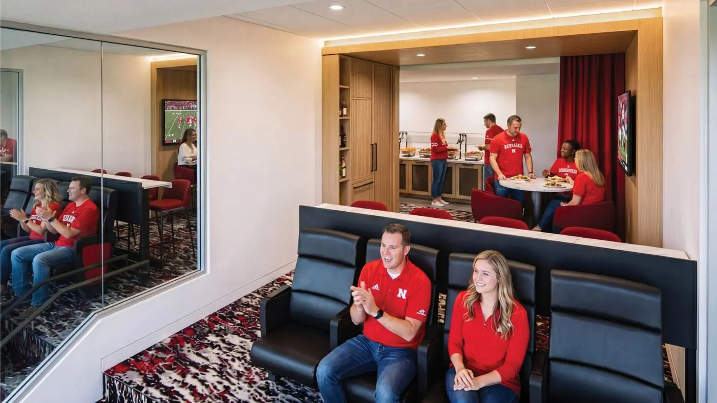 Rendering of a smaller renovated West Suite interior with two rows of lounge seating and a pantry